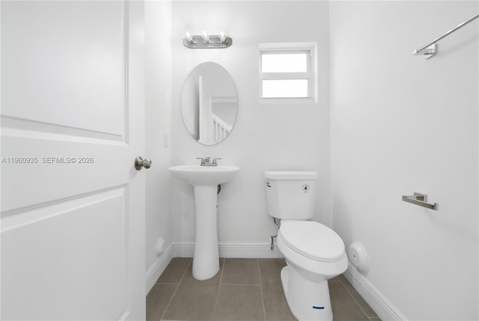 529 Northwest 56th Street Miami, FL 33127 - Photo 65 of 66 a white toilet sitting next to a shower