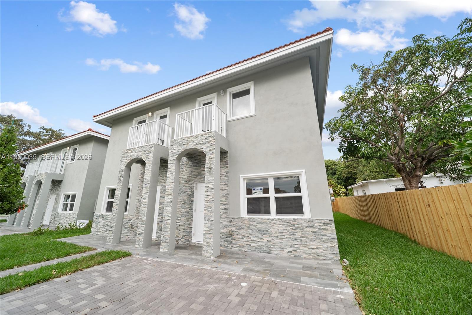 529 Northwest 56th Street Miami, FL 33127 - Photo 8 of 66 a front view of a house with a yard