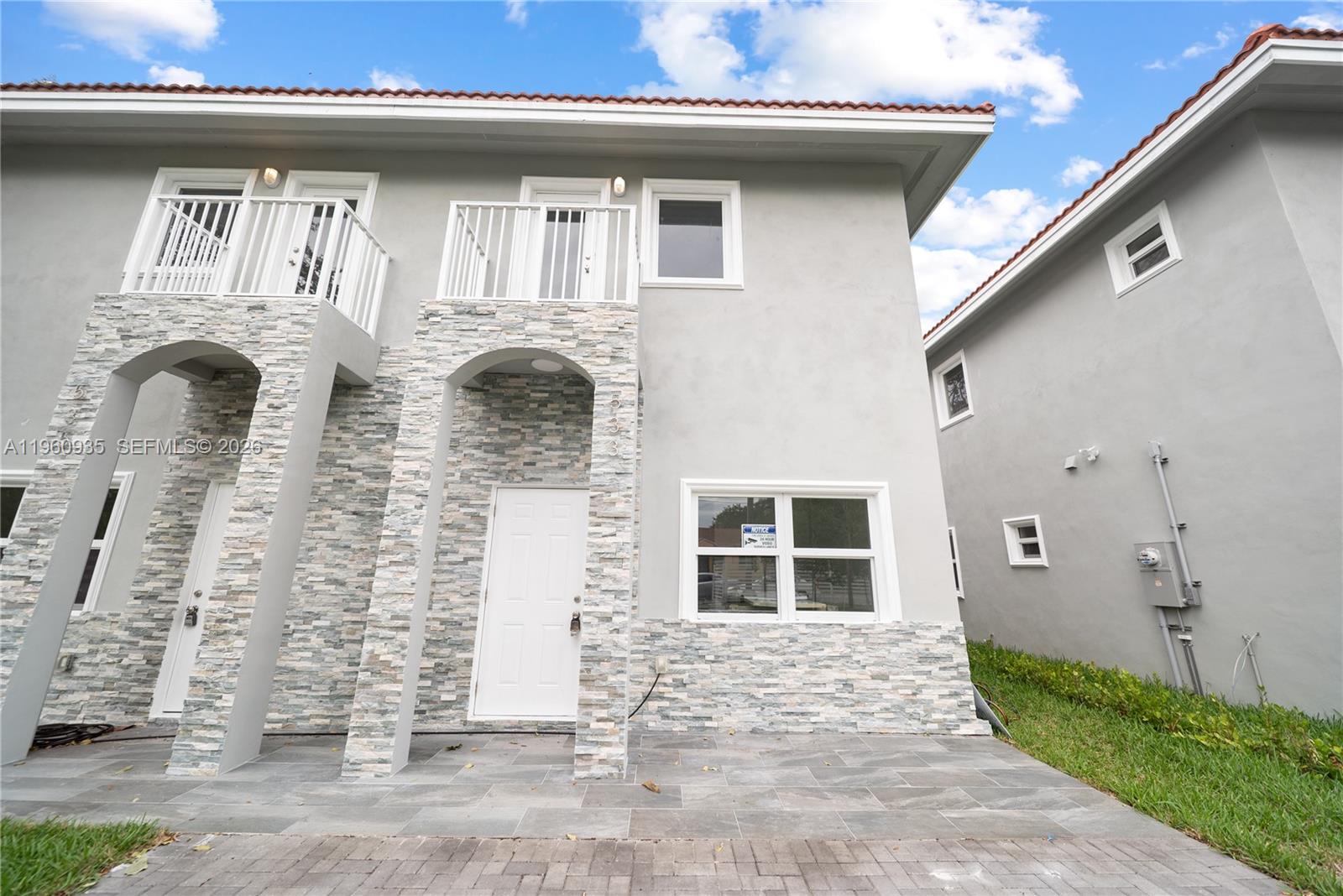 529 Northwest 56th Street Miami, FL 33127 - Photo 9 of 66 a front view of a house with a garden