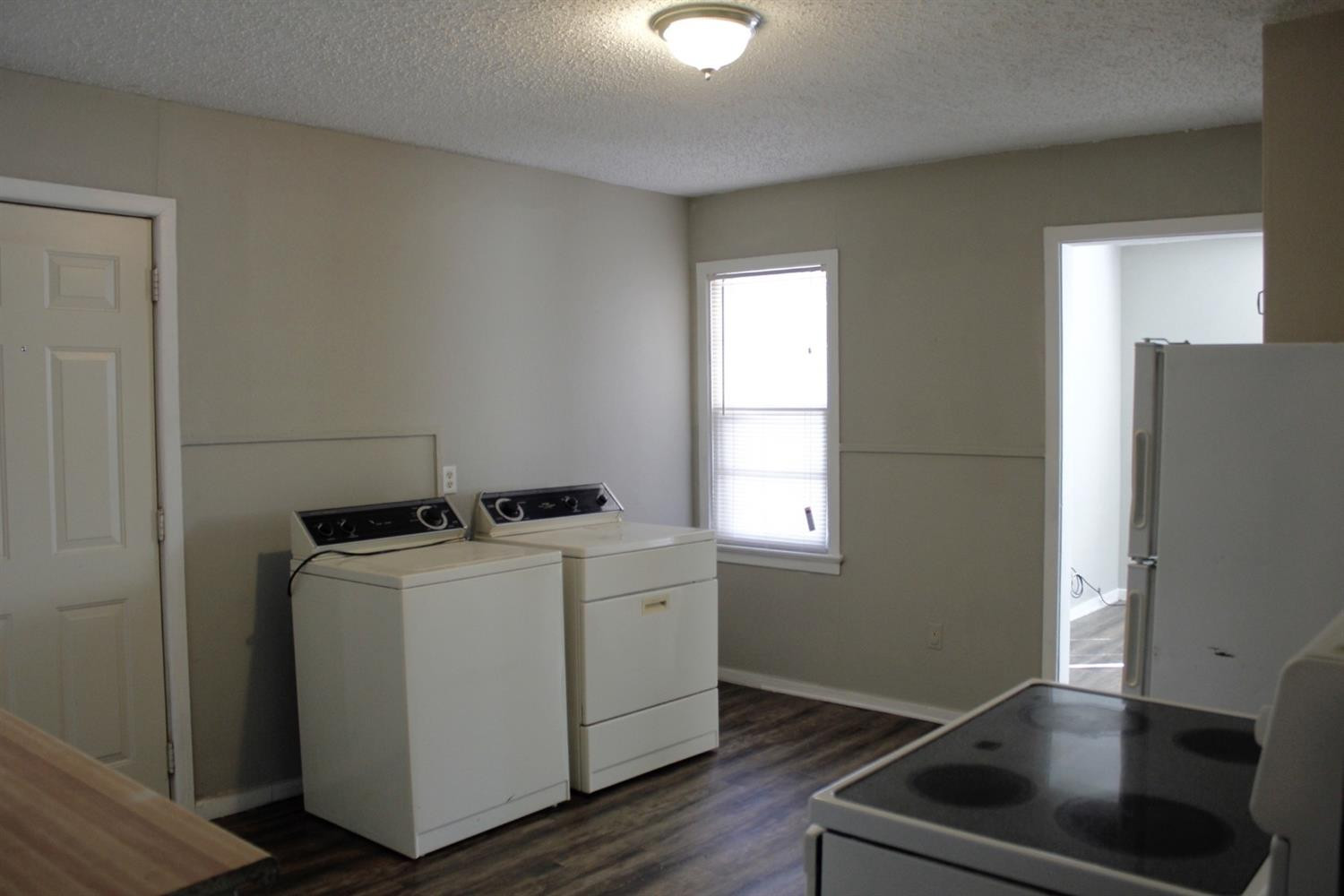 4424 36th Street, Unit A Lubbock, TX 79414 - Photo 4 of 6 a room with storage and utility