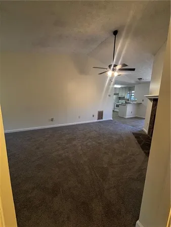 a view of an empty room and a window