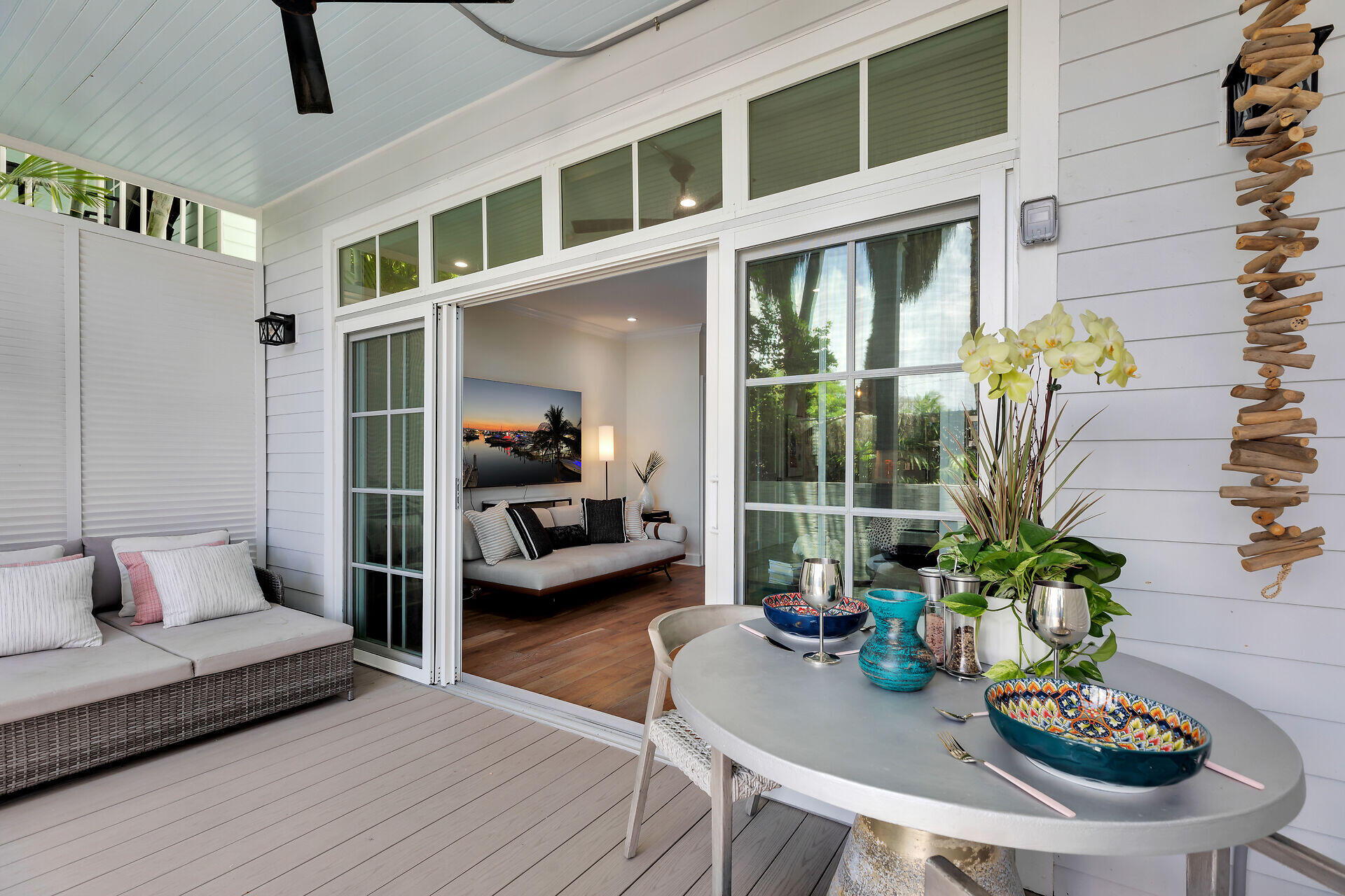 205 Virginia Street Key West, FL 33040 - Photo 12 of 41 a living room with furniture and a potted plant