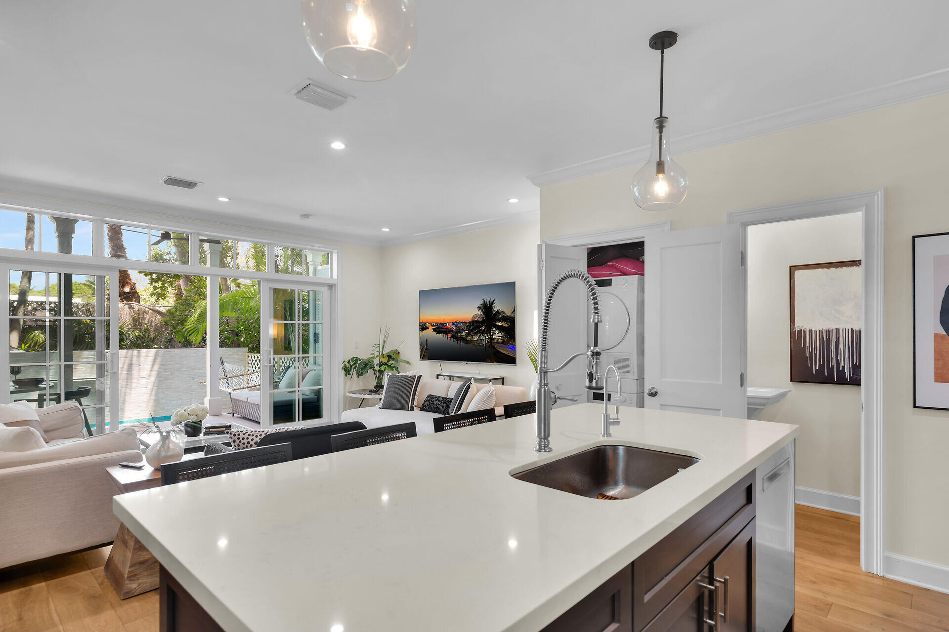 205 Virginia Street Key West, FL 33040 - Photo 17 of 41 a kitchen with a sink a counter top space and living room view