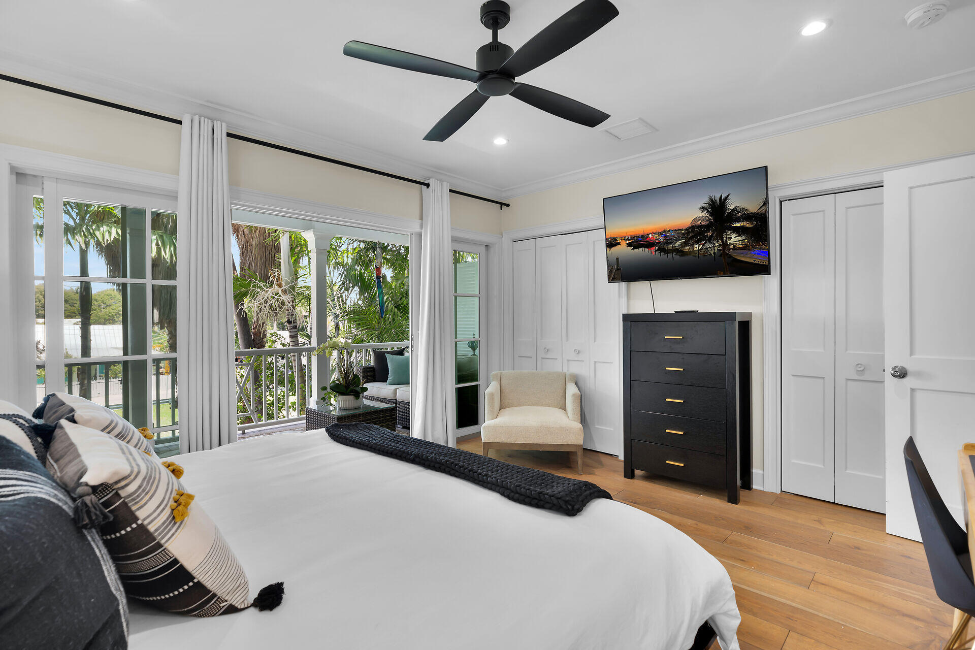 205 Virginia Street Key West, FL 33040 - Photo 22 of 41 a bedroom with a bed and a large window