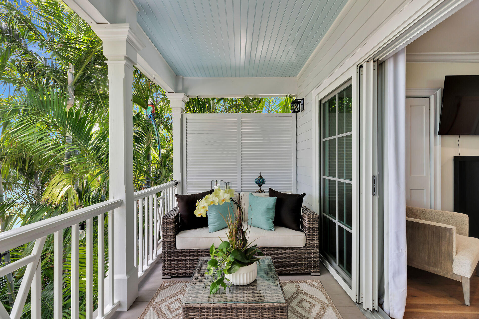 205 Virginia Street Key West, FL 33040 - Photo 25 of 41 a balcony with furniture and a potted plant