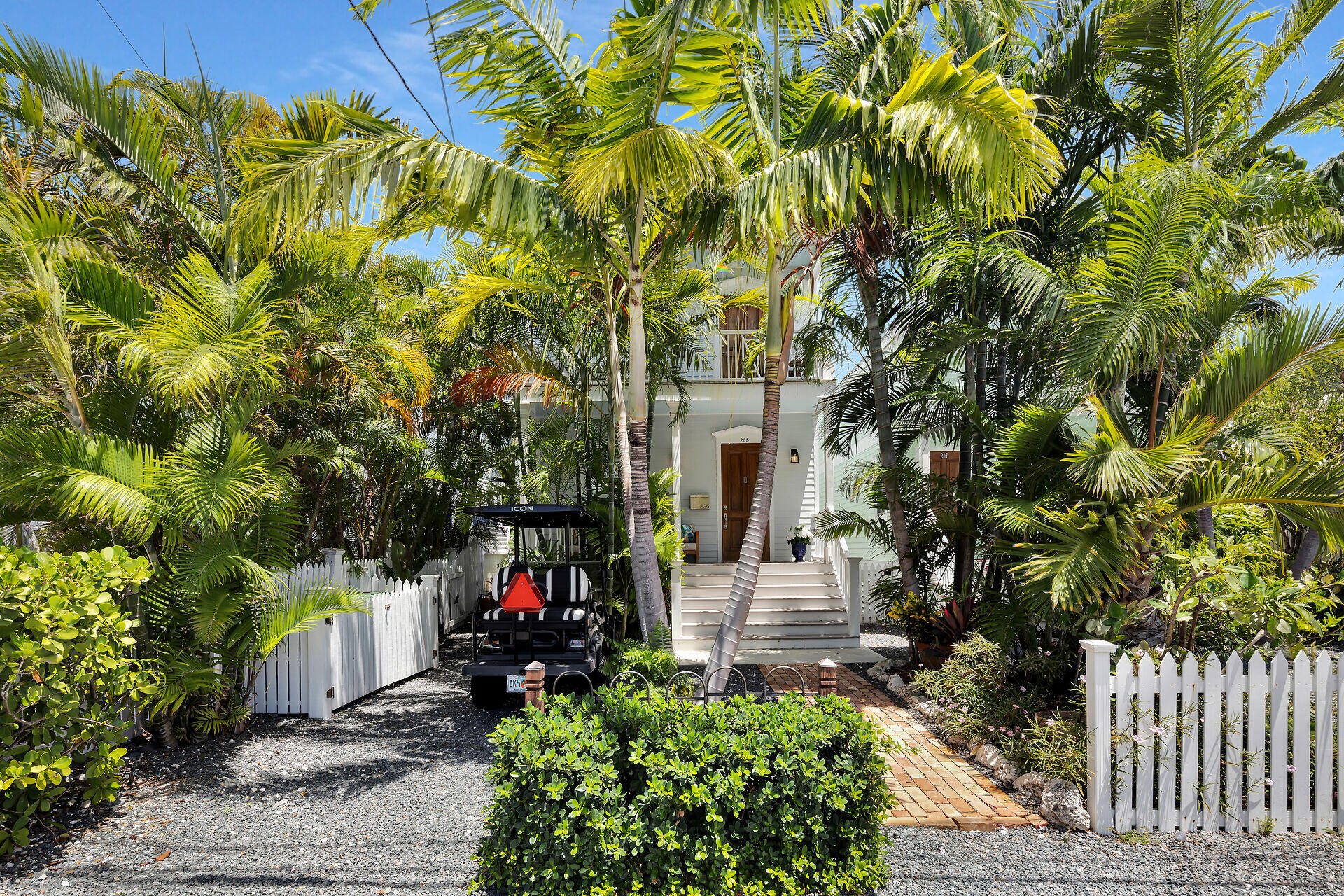 205 Virginia Street Key West, FL 33040 - Photo 3 of 41 a view of a patio with table and chairs and potted plants