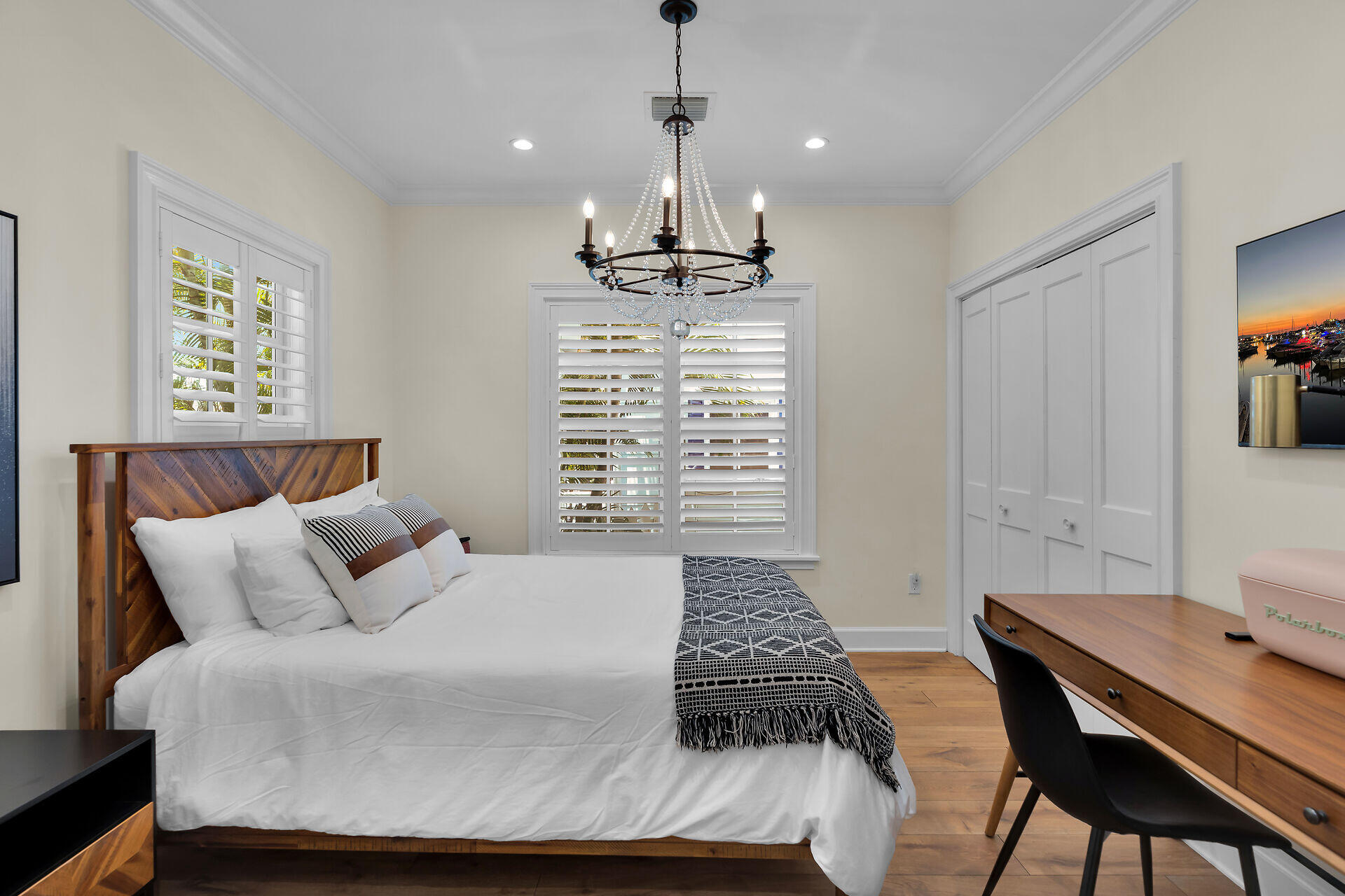 205 Virginia Street Key West, FL 33040 - Photo 32 of 41 a bedroom with a bed and a table in it