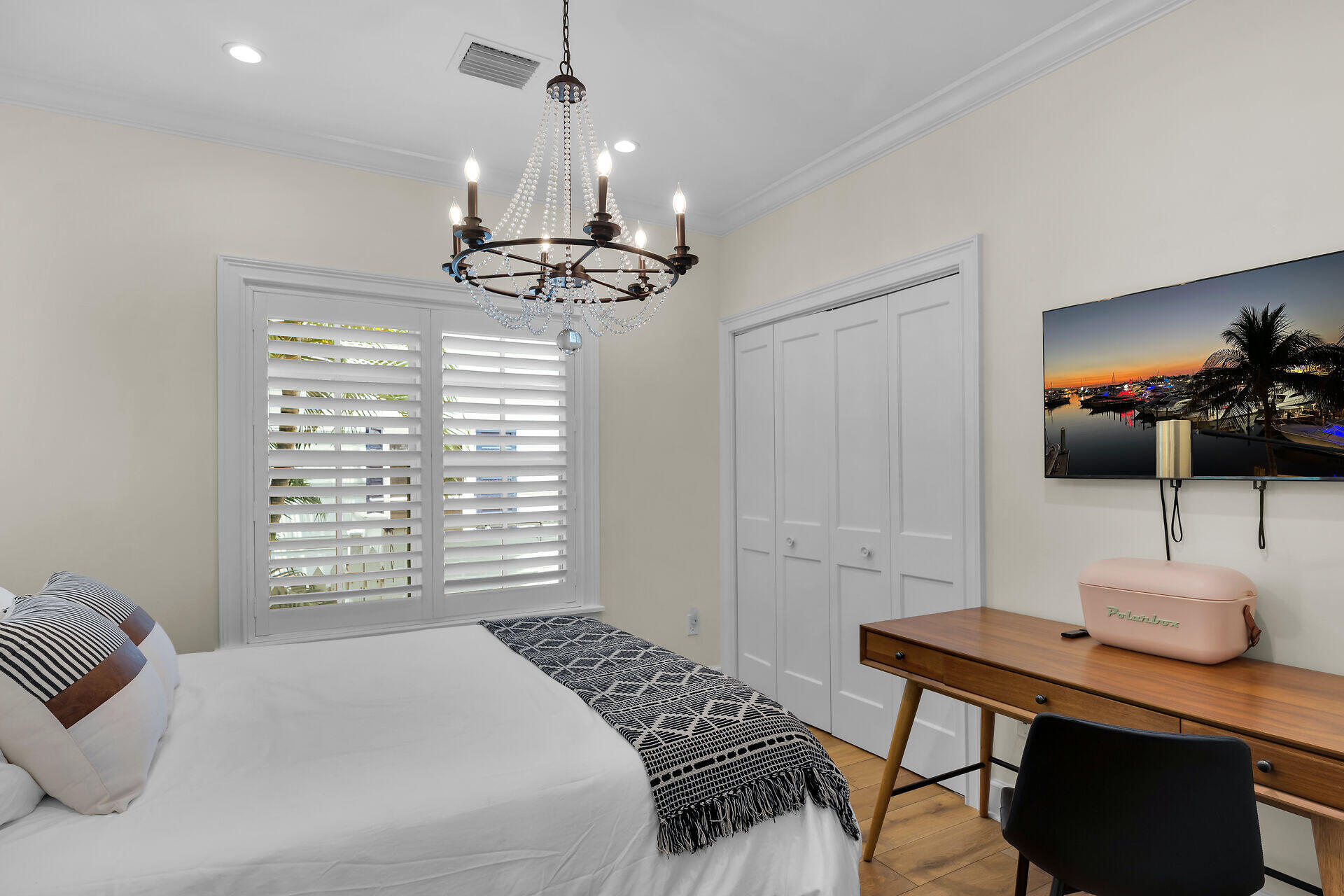 205 Virginia Street Key West, FL 33040 - Photo 33 of 41 a bedroom with a bed a large window and a flat screen tv