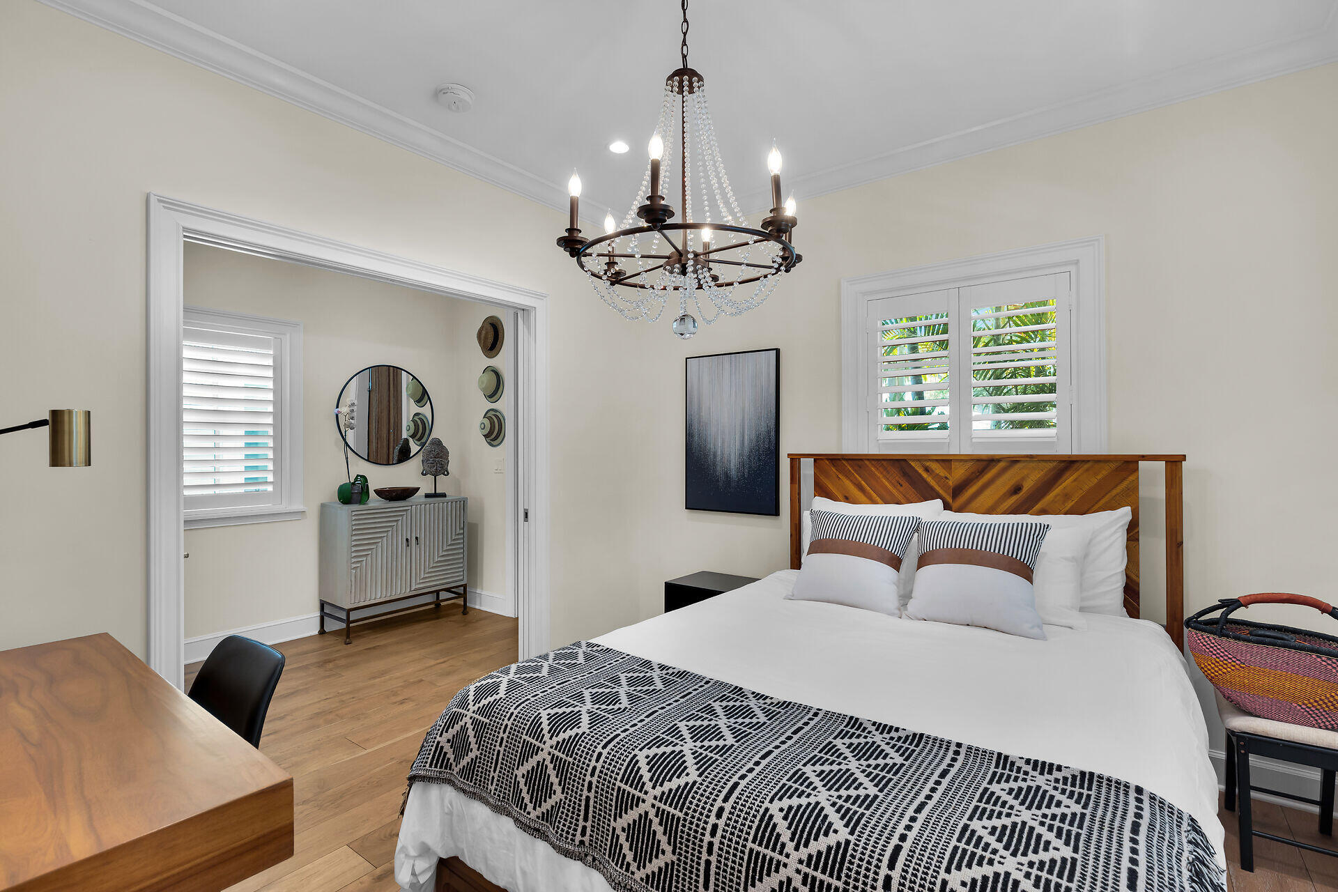 205 Virginia Street Key West, FL 33040 - Photo 34 of 41 a bedroom with a bed and a chandelier