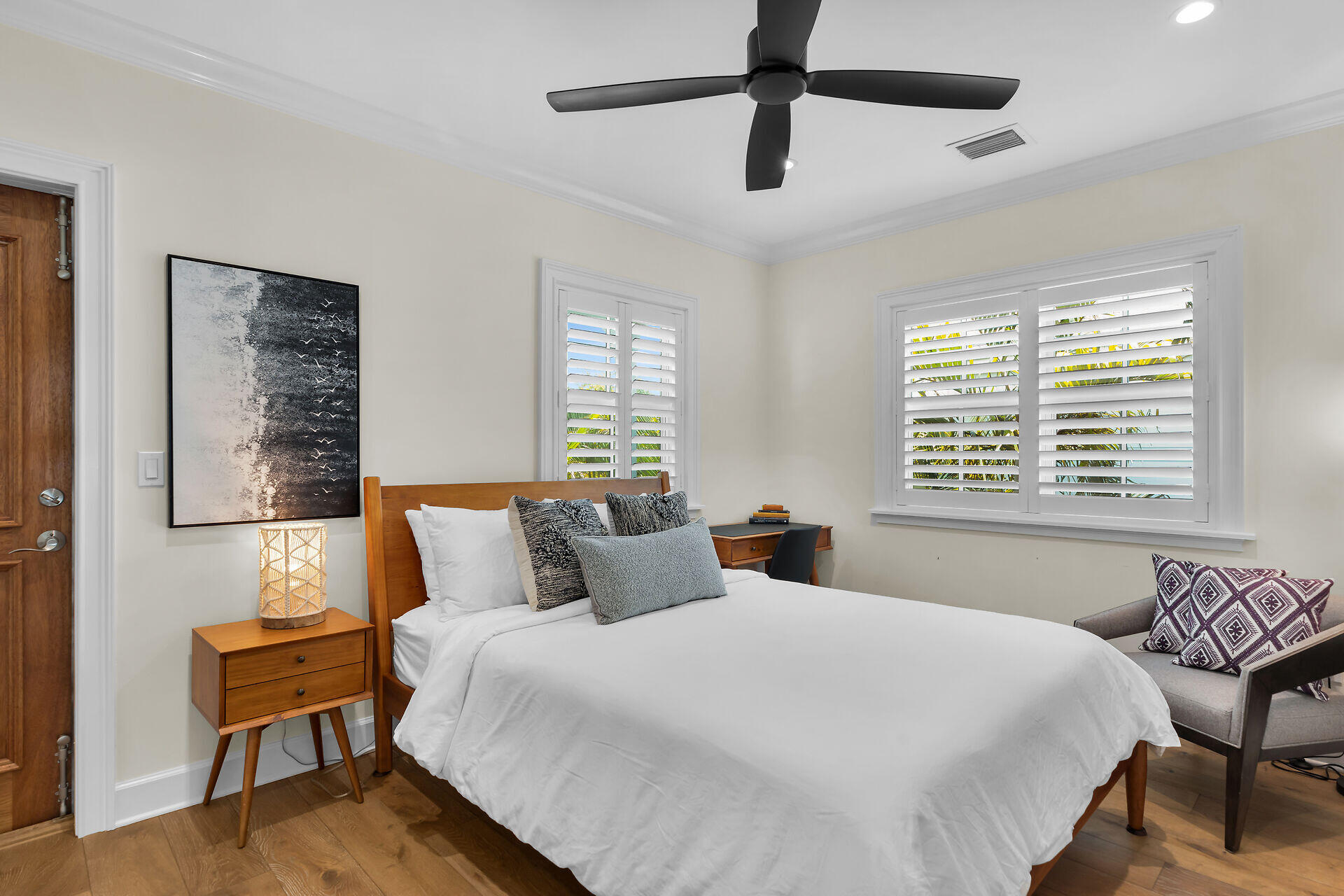 205 Virginia Street Key West, FL 33040 - Photo 35 of 41 a bedroom with a bed and a chair