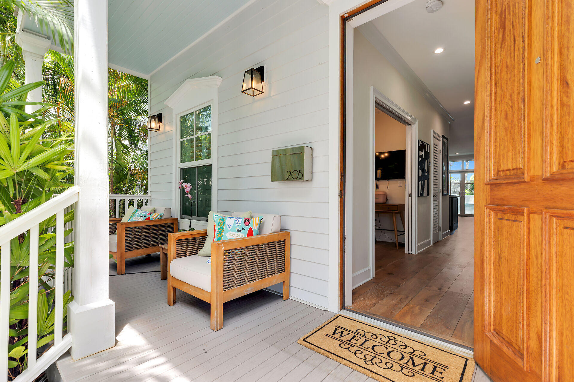 205 Virginia Street Key West, FL 33040 - Photo 7 of 41 a living room with furniture and a table