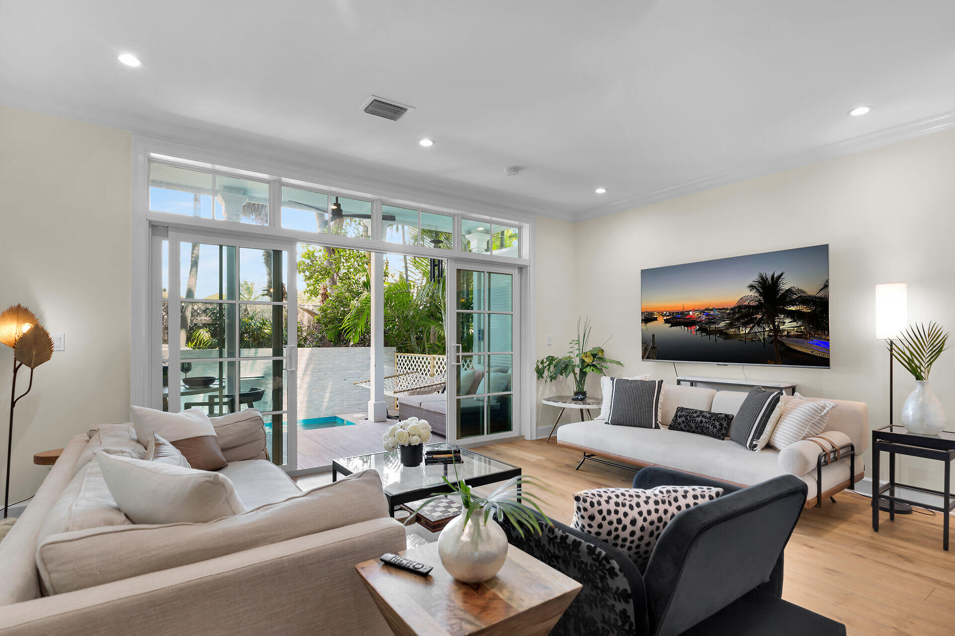 205 Virginia Street Key West, FL 33040 - Photo 8 of 41 a living room with furniture and a flat screen tv