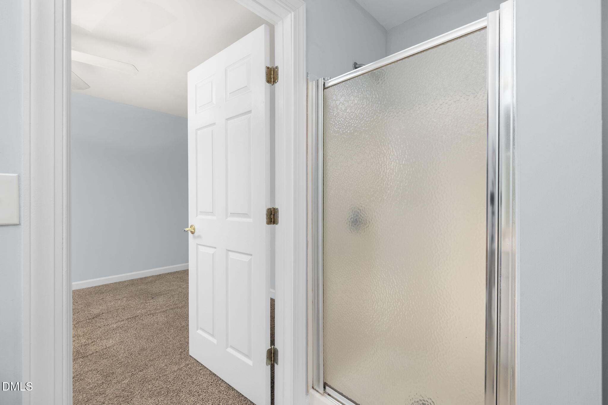 929 Morreene Road, Unit C23 Durham, NC 27705 - Photo 31 of 33 a bathroom with a glass shower door