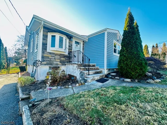 a backyard of a house with yard and outdoor seating