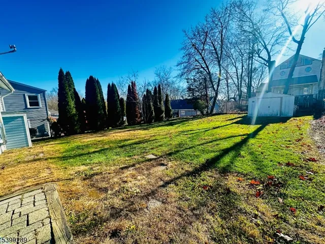 a swimming pool with outdoor seating and yard
