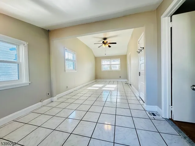 a view of empty room with windows