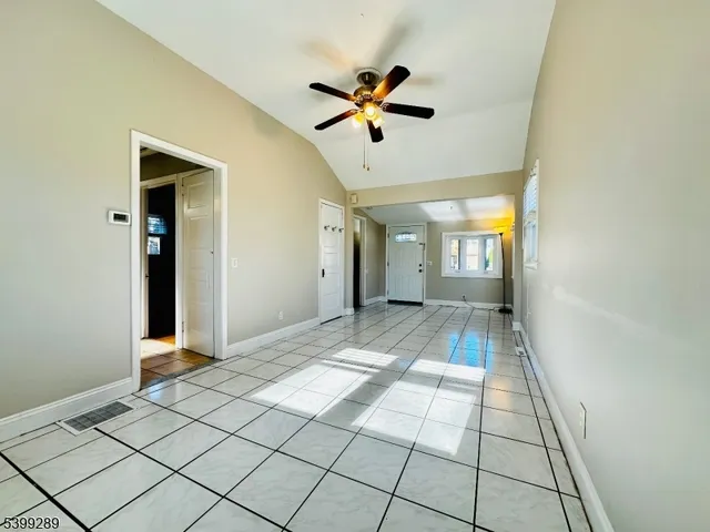 a view of entryway with a window and a chandelier
