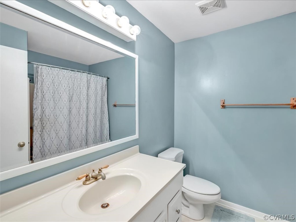 12402 South Ridge Circle Midlothian, VA 23112 - Photo 8 of 16 a bathroom with a sink a toilet and shower