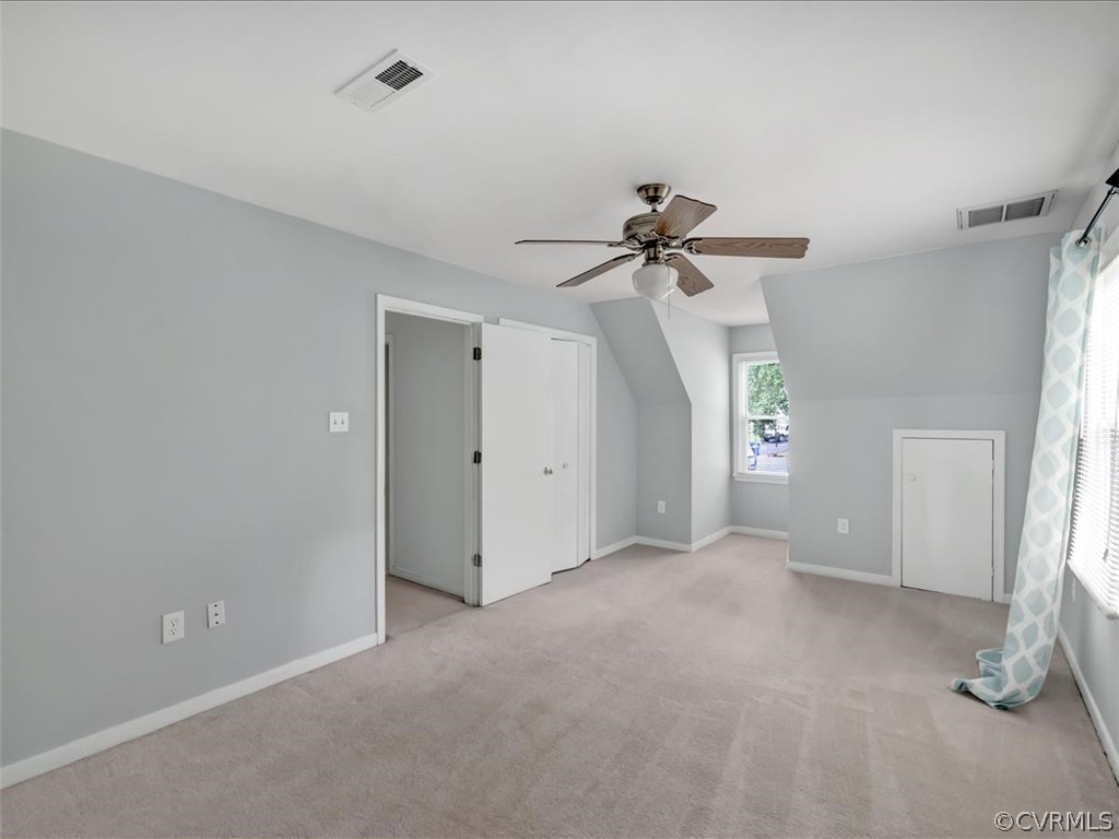 12402 South Ridge Circle Midlothian, VA 23112 - Photo 9 of 16 a view of a room with a ceiling fan and a window