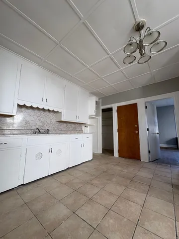 a view of a kitchen with cabinet cabinets and a kitchen