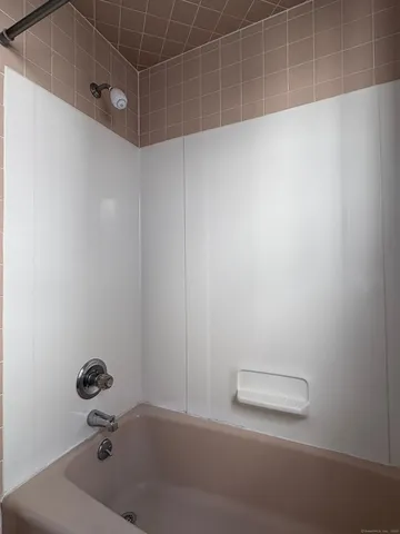 a bathroom with a granite countertop sink a mirror and vanity
