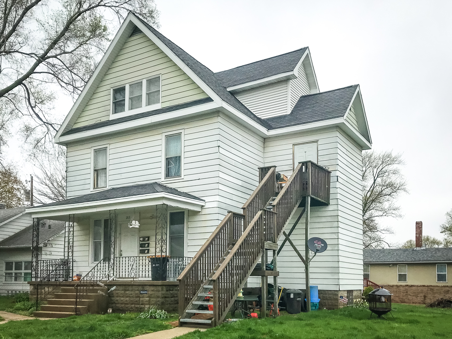 203 5th Avenue Rochelle, IL 61068 - Photo 2 of 25 a front view of a house with a yard