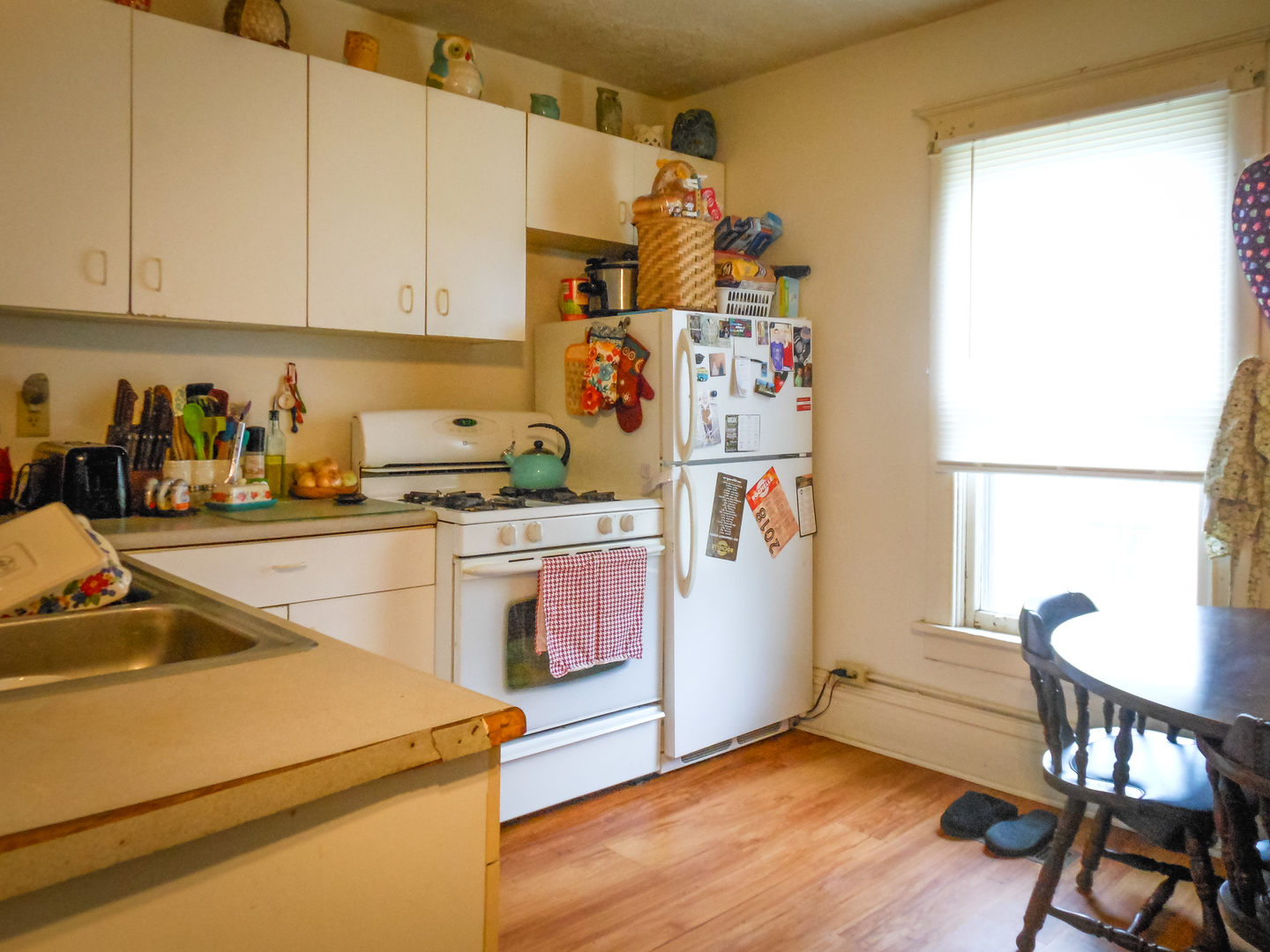 203 5th Avenue Rochelle, IL 61068 - Photo 11 of 25 a kitchen with a refrigerator and a stove top oven