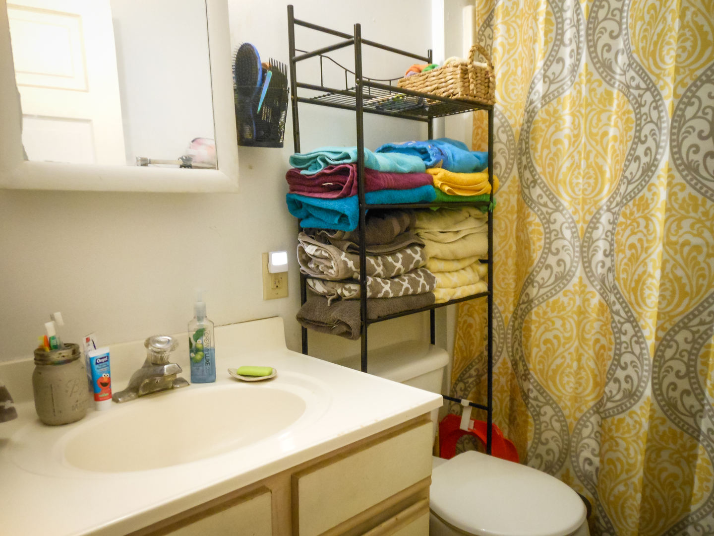 203 5th Avenue Rochelle, IL 61068 - Photo 16 of 25 a bathroom with a sink and a toilet