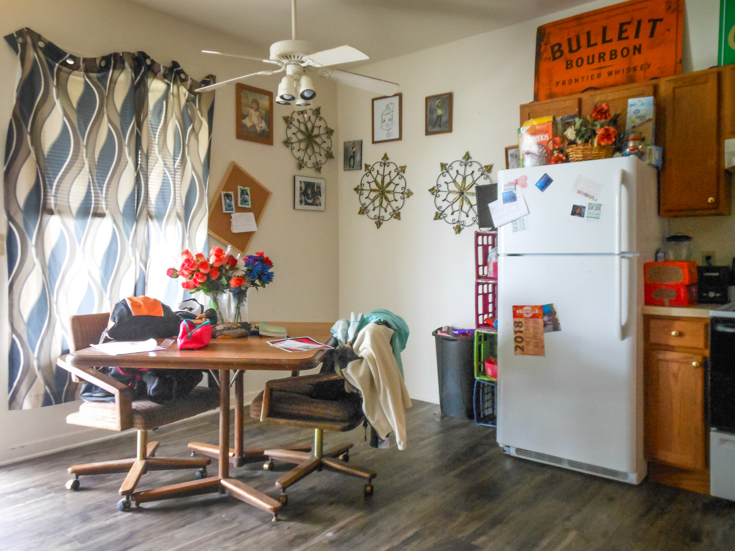 203 5th Avenue Rochelle, IL 61068 - Photo 18 of 25 a white kitchen with a refrigerator and a table