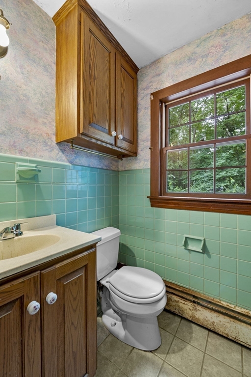 20 Main Street Boxford, MA 01921 - Photo 19 of 40 a bathroom with a sink a toilet and a window