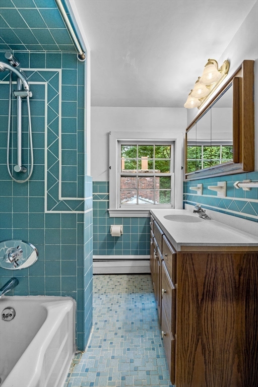 20 Main Street Boxford, MA 01921 - Photo 26 of 40 a bathroom with a sink a toilet and a shower
