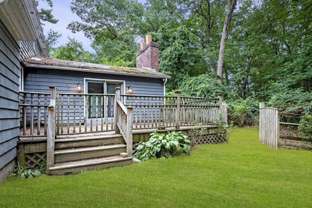 20 Main Street Boxford, MA 01921 - Photo 35 of 40 a front view of a house with a yard table and chairs