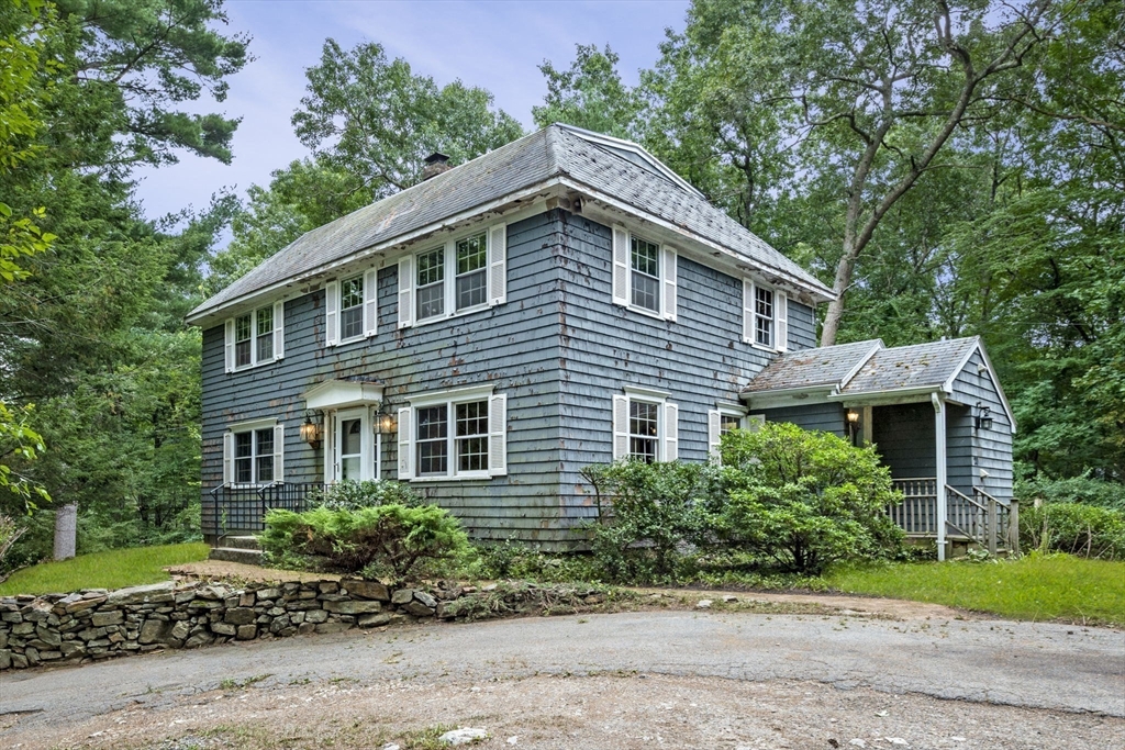 20 Main Street Boxford, MA 01921 - Photo 7 of 40 a front view of a house with a garden