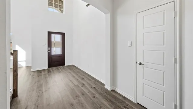 a view of a livingroom with a ceiling fan and window