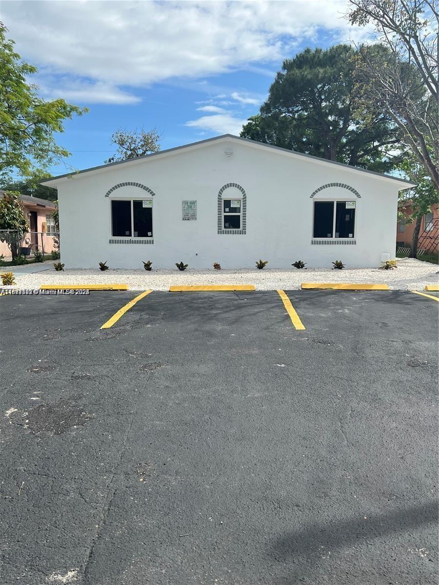 a house with swimming pool in front of it