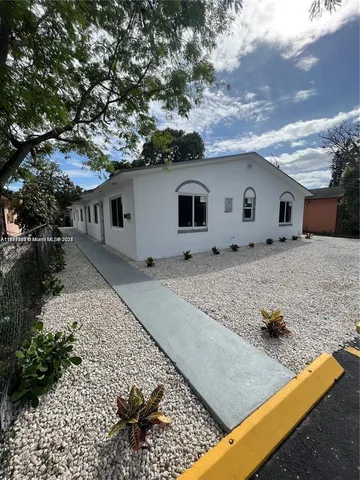 a house view with a backyard space