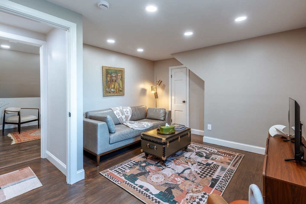 585 Station Road Amherst, MA 01002 - Photo 26 of 42 a living room with furniture and a rug