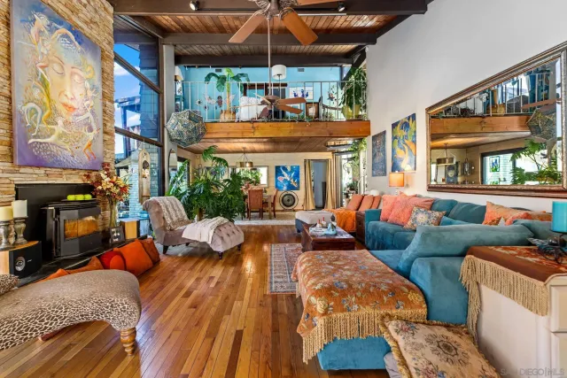 a outdoor space with patio couches and a fireplace