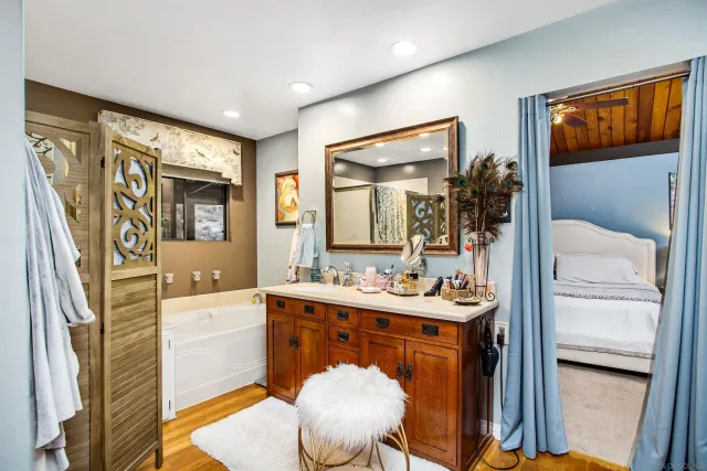 a bedroom with a bed and a dresser