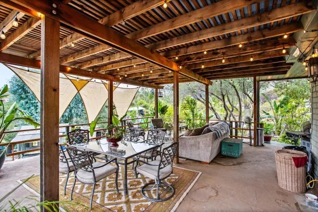 a view of dinning table and chairs in patio
