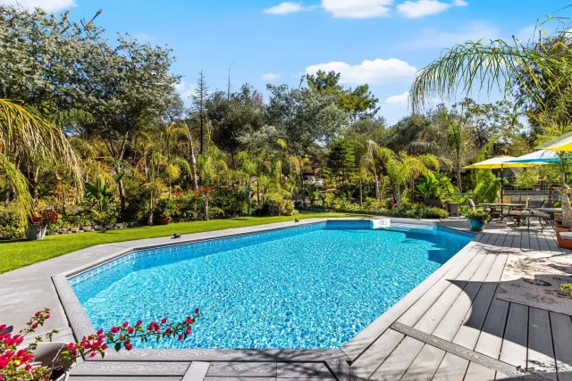 a view of a backyard with sitting area