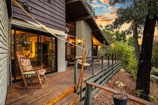 a view of a house with a snow on the road