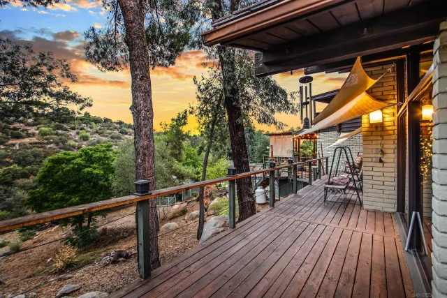 a view of a swimming pool with chairs in patio