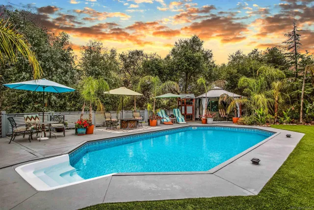 an aerial view of a house with yard