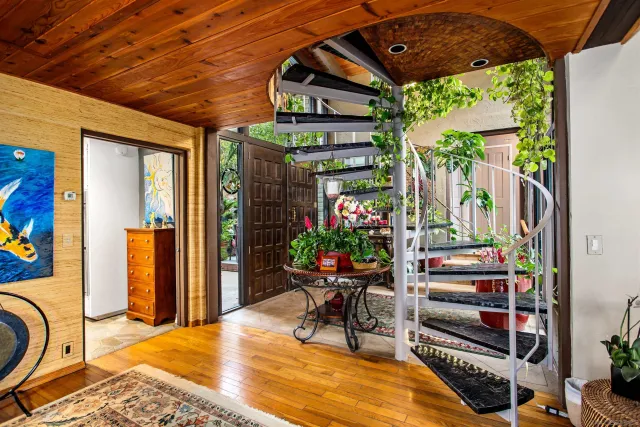 a outdoor seating area with furniture and potted plants