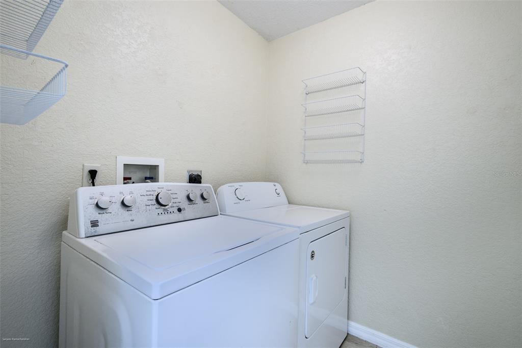 311 Goiana Street Punta Gorda, FL 33983 - Photo 15 of 40 a utility room with dryer and washer