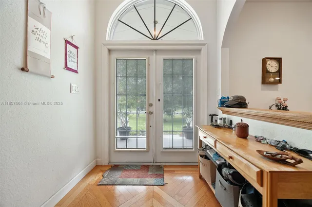 a kitchen with stainless steel appliances a stove and a window