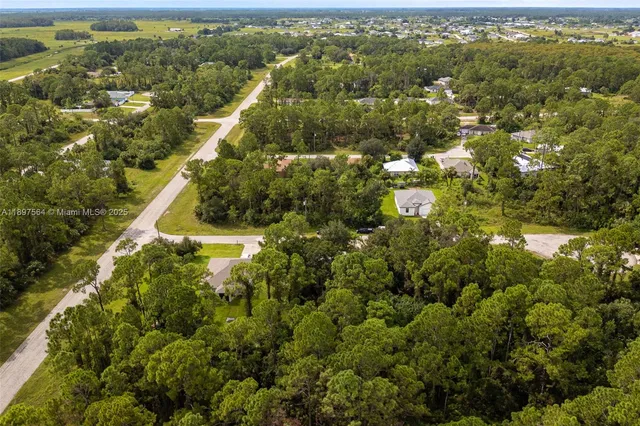 a view of a yard with an outdoor seating