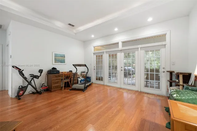 a view of a livingroom with furniture and a hardwood