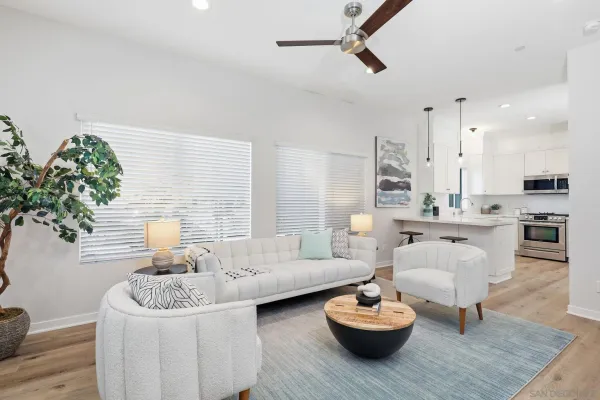 a living room with furniture and a large window